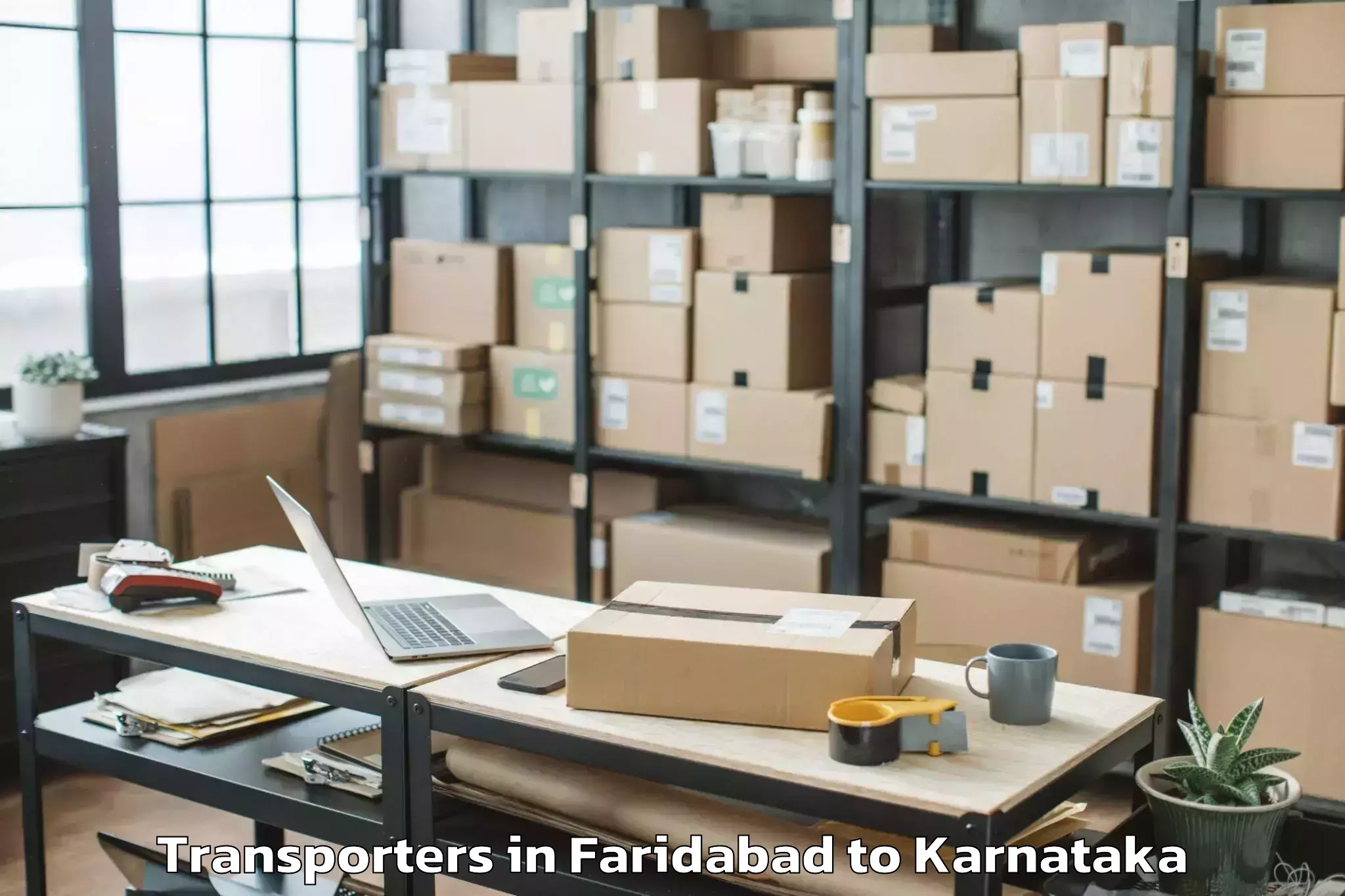 Leading Faridabad to Karnataka Janapada Vishwavidya Transporters Provider